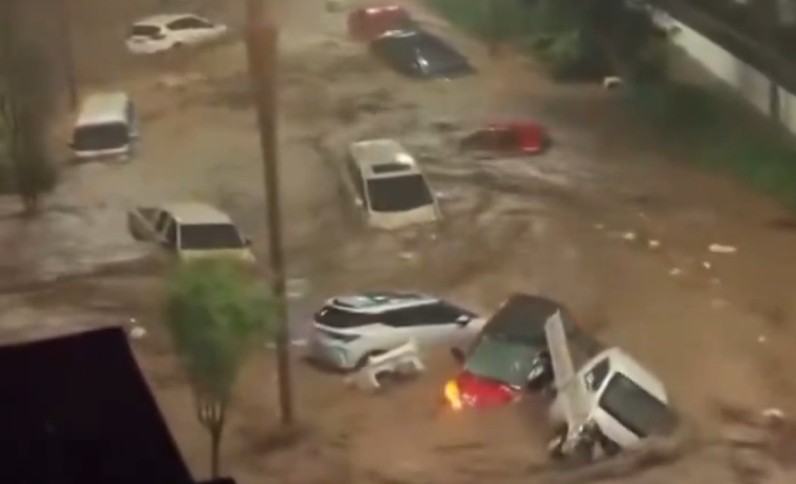 flash-floods-sweep-away-cars,-cut-roads-to-villages-in-northern-china