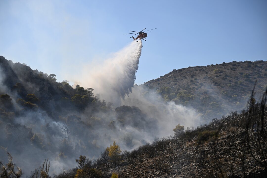 firefighters-battle-massive-wildfires-in-belgium-and-greece-as-2-die-on-island-near-athens